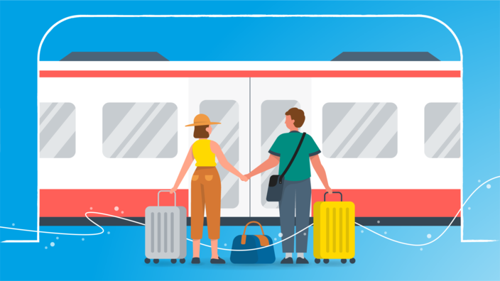 Ein Paar steht mit Koffern vor einem Zug. 